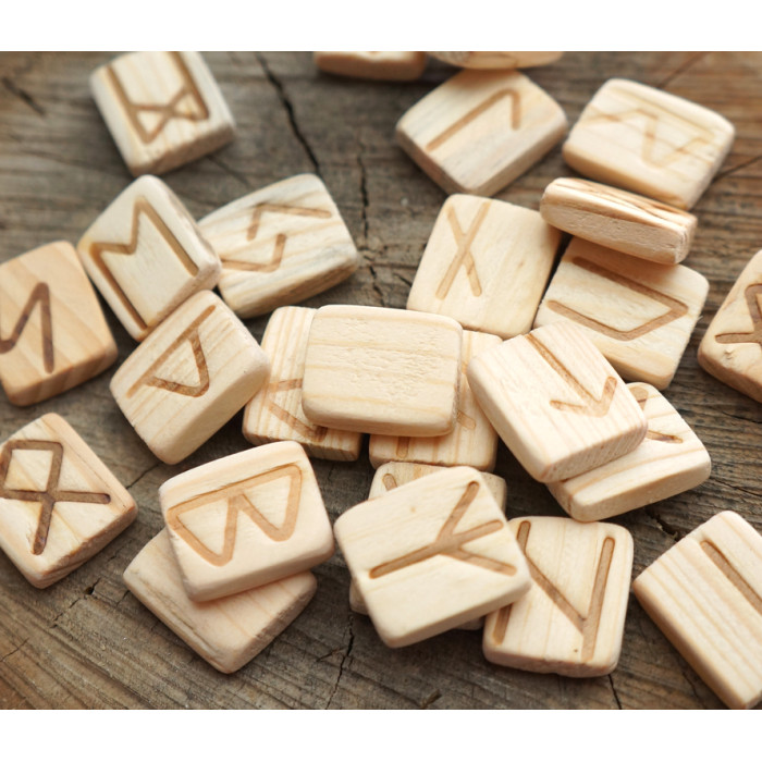 A set of wooden runes for divination with an annotation Mulberry
