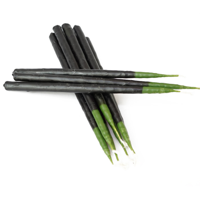 Candle dipped green in black