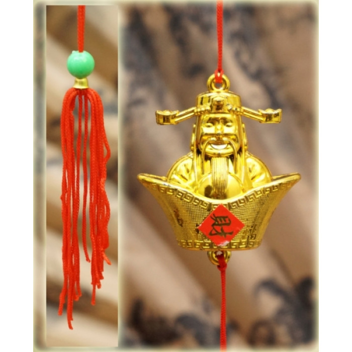 Plastic Feng Shui pendant with Tai Sen tassel in a bowl of abundance